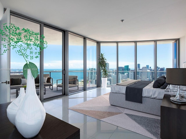 bedroom with a water view, a wall of windows, tile floors, and access to outside