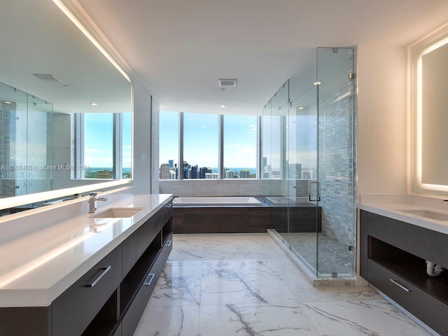 bathroom with floor to ceiling windows, independent shower and bath, vanity, and tile floors