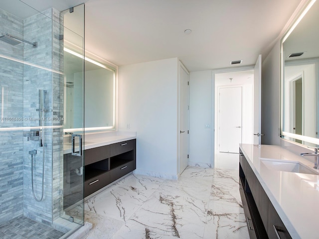 bathroom featuring vanity, an enclosed shower, and tile floors