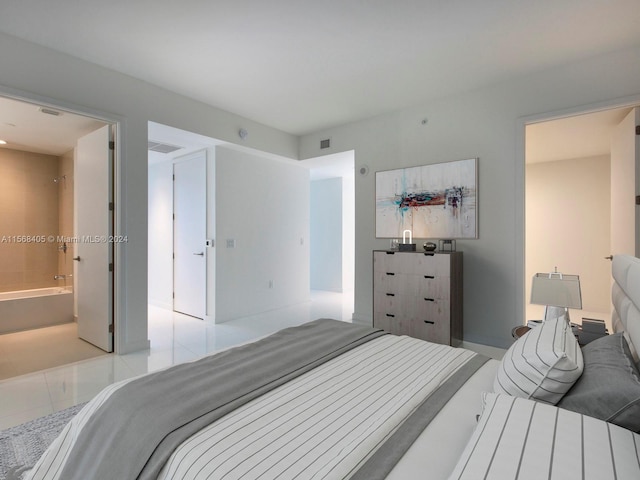 tiled bedroom with connected bathroom