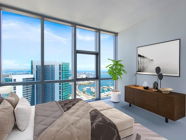 tiled bedroom featuring multiple windows, a water view, and expansive windows