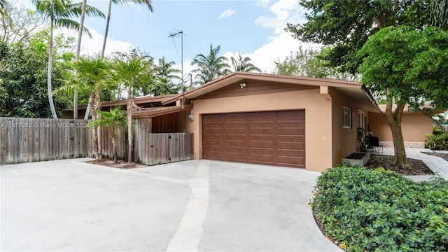 single story home featuring a garage