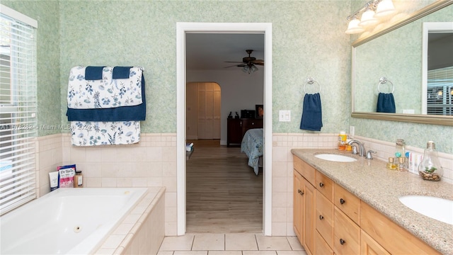 bathroom featuring vanity, tiled bath, tile patterned floors, and ceiling fan