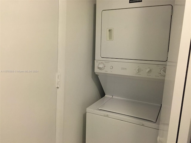 laundry area featuring stacked washing maching and dryer