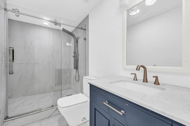 bathroom featuring a shower with door, toilet, tile floors, and vanity