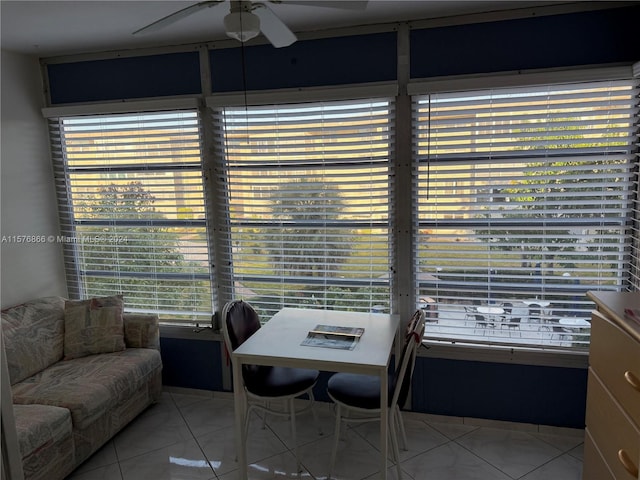 dining area with ceiling fan and light tile patterned floors