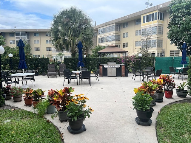 view of community with area for grilling and a patio area