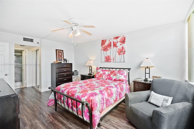 bedroom with dark hardwood / wood-style floors and ceiling fan