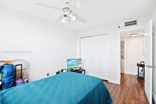 bedroom featuring ceiling fan, a closet, and wood-type flooring