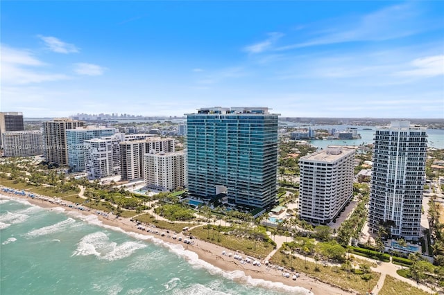 aerial view with a water view and a beach view