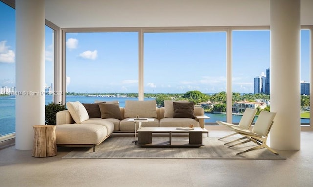 sunroom / solarium featuring a wealth of natural light and a water view