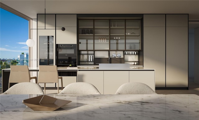 bar with light stone countertops, a wall of windows, and black double oven