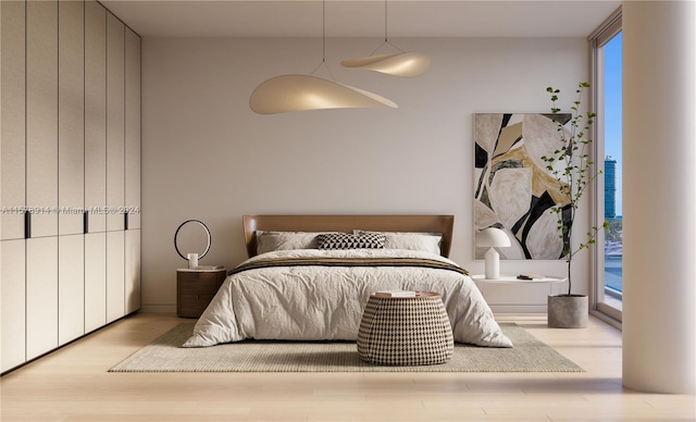 bedroom featuring light wood-type flooring