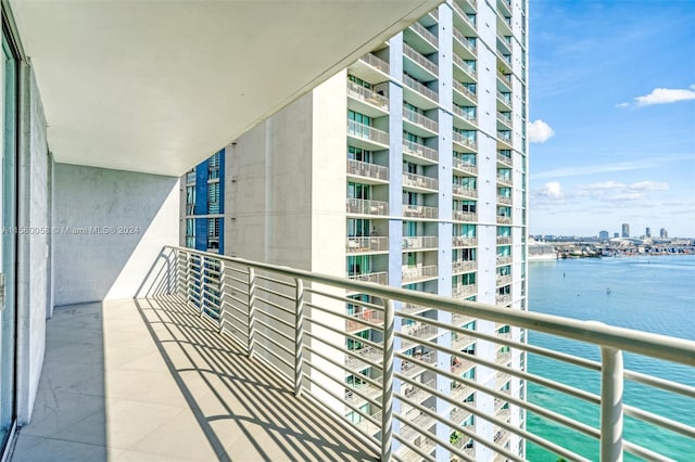 balcony featuring a water view