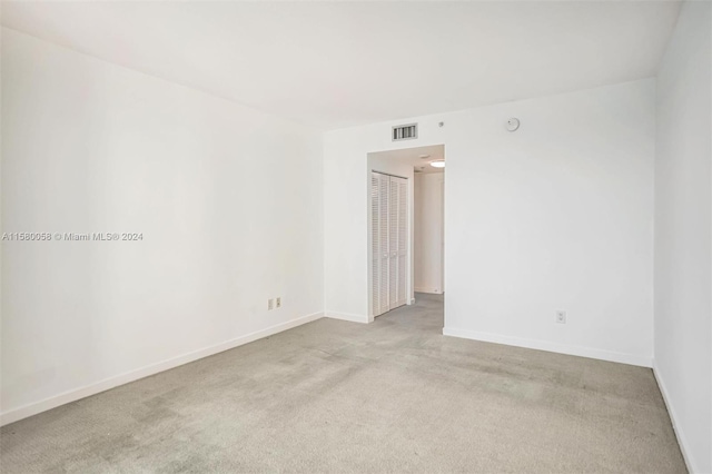 empty room featuring light colored carpet