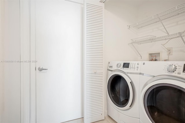 laundry room featuring washing machine and dryer