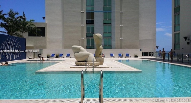 view of swimming pool featuring a patio