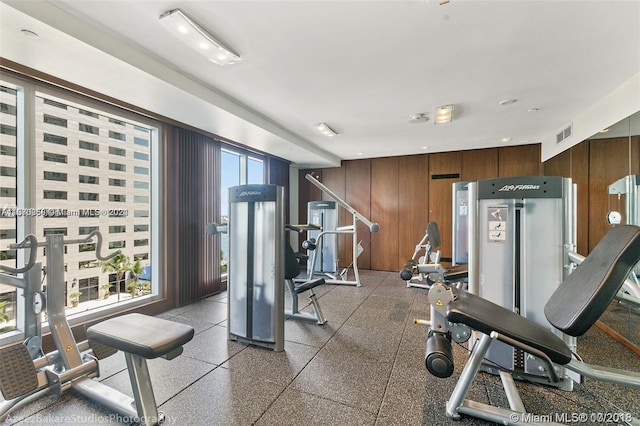 workout area featuring wooden walls