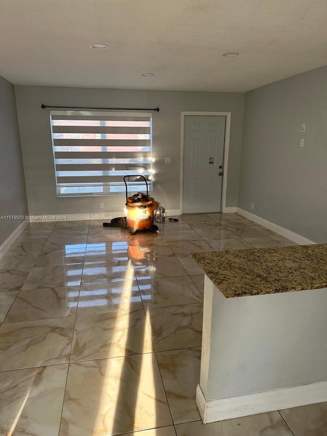 spare room featuring tile flooring