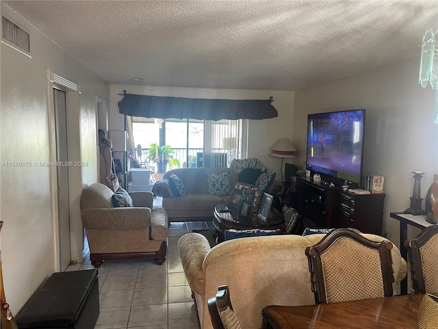 tiled living room with a textured ceiling