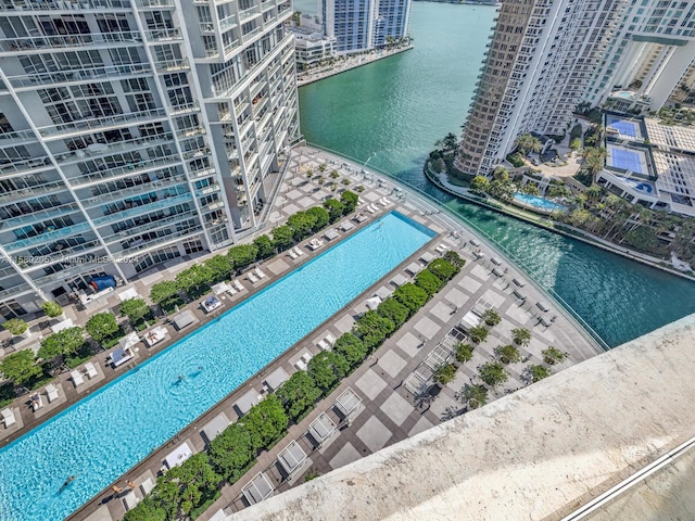 birds eye view of property with a water view