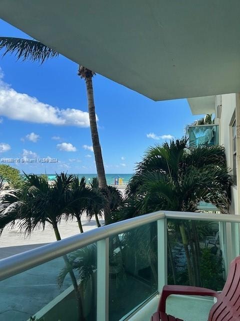 balcony featuring a water view