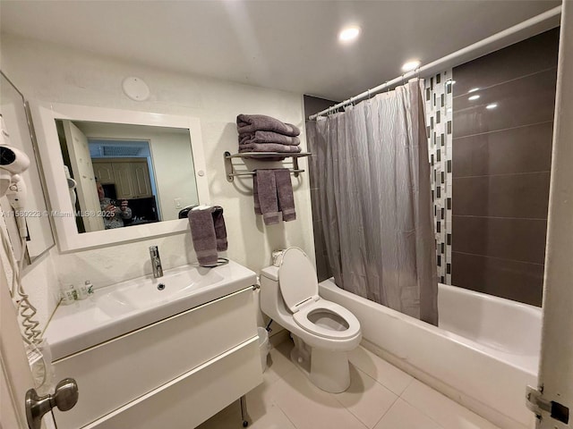 full bathroom featuring tile patterned floors, vanity, shower / bath combo, and toilet