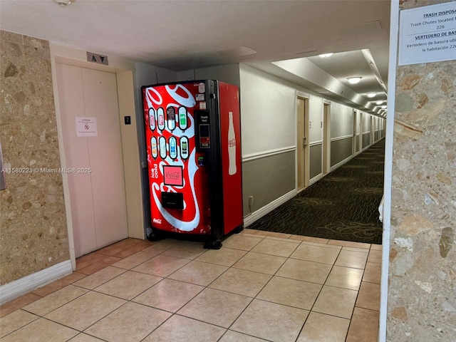 hall featuring light tile patterned floors