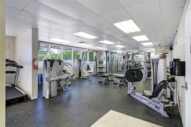 workout area with a paneled ceiling