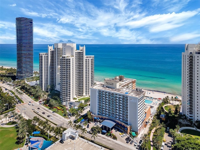 birds eye view of property featuring a view of the beach and a water view