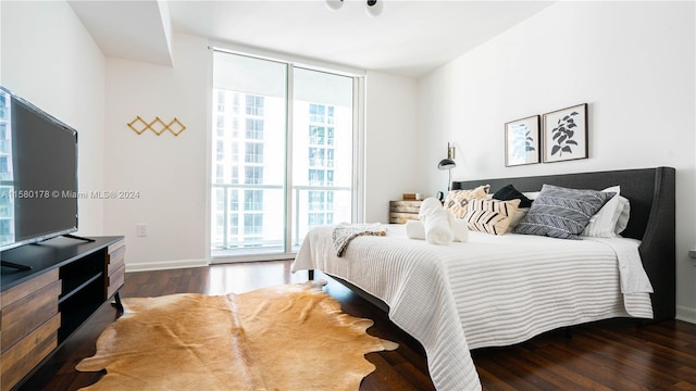 bedroom featuring dark hardwood / wood-style flooring