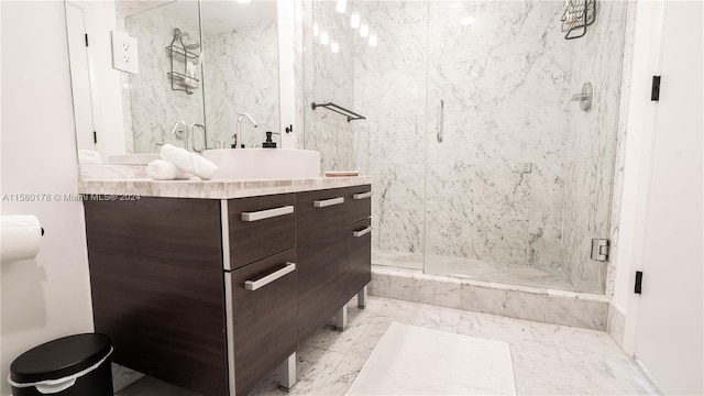 bathroom with tile flooring, walk in shower, and vanity with extensive cabinet space