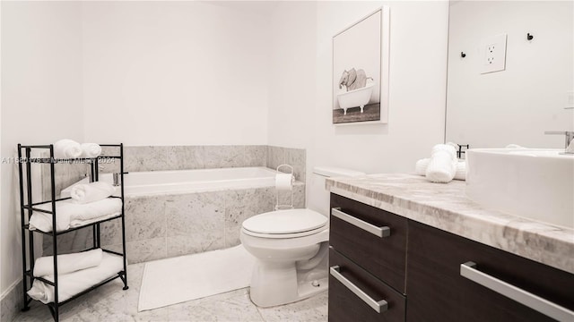 bathroom with vanity, tile floors, toilet, and tiled bath