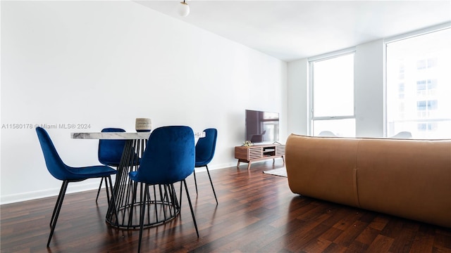 dining room with dark wood-type flooring