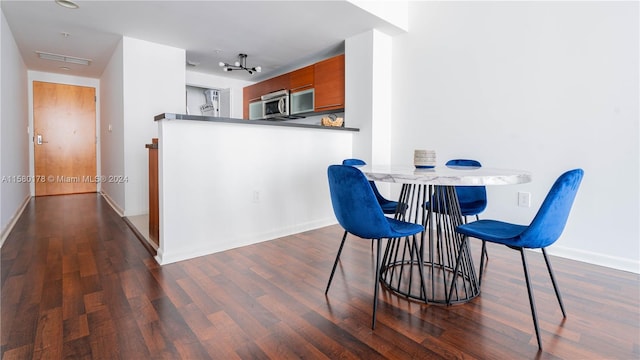 dining room featuring dark hardwood / wood-style flooring