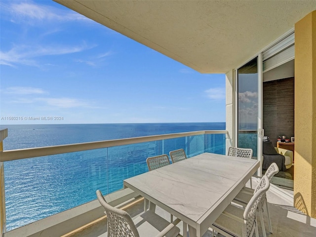 balcony featuring a water view