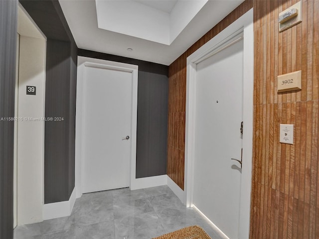 hallway featuring light tile floors