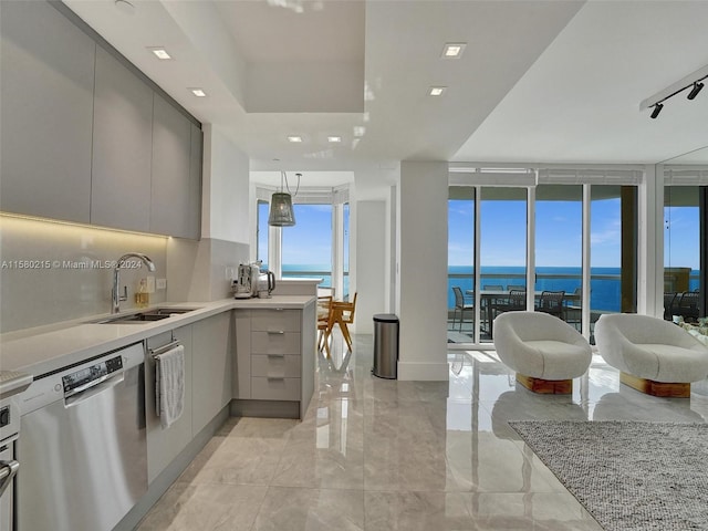 kitchen featuring gray cabinets, a water view, light tile floors, sink, and dishwasher