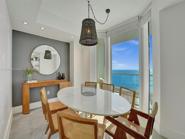 dining area featuring a water view