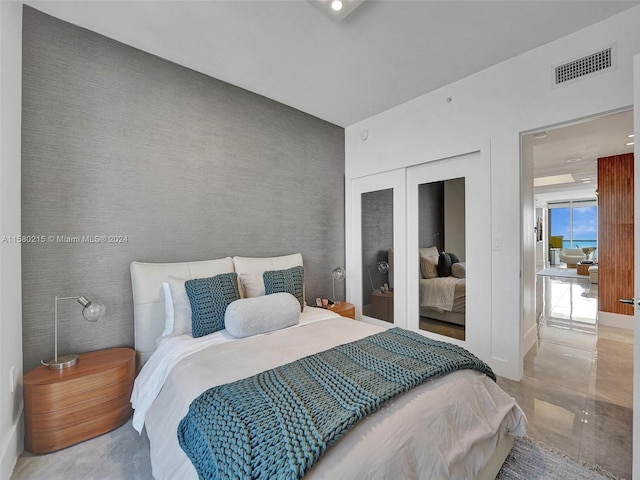 bedroom featuring a closet and tile floors