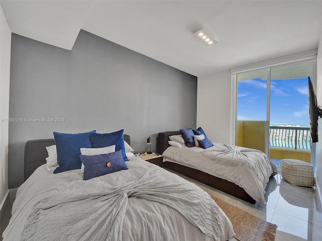 bedroom with tile flooring and access to outside