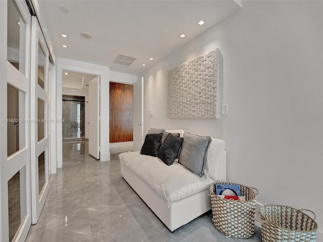 sitting room with tile flooring