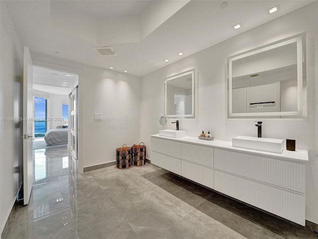 bathroom featuring tile flooring and double sink vanity