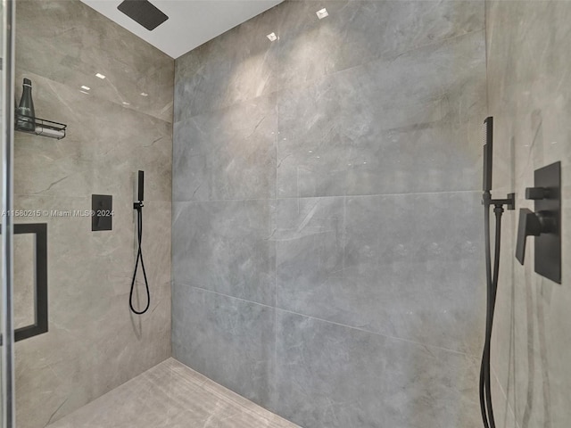 bathroom with a tile shower