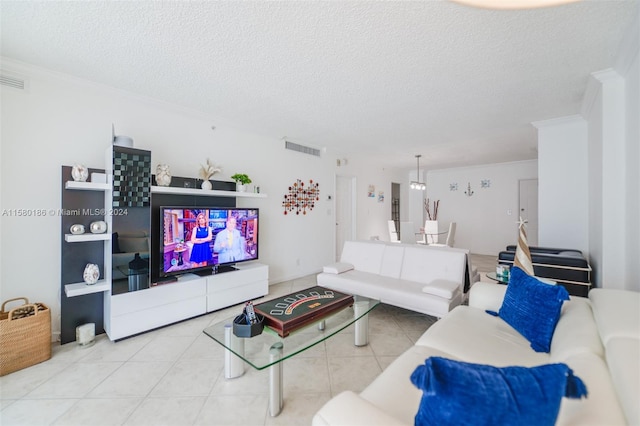 living room with a textured ceiling, crown molding, and light tile flooring