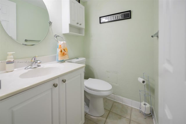 bathroom featuring large vanity, tile floors, and toilet