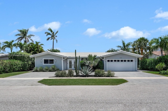 single story home featuring a garage