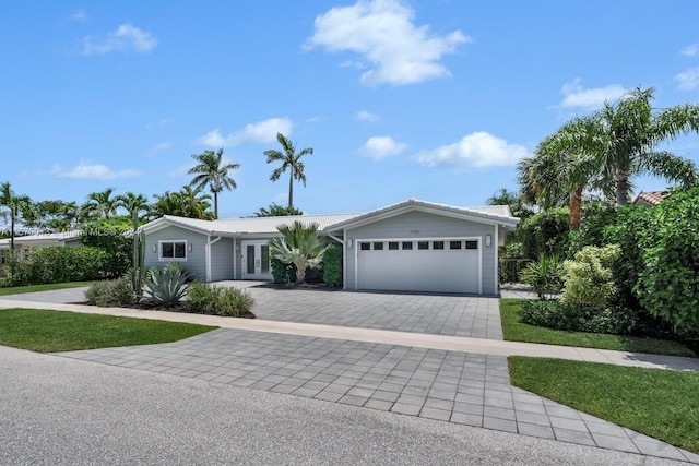 single story home featuring a garage