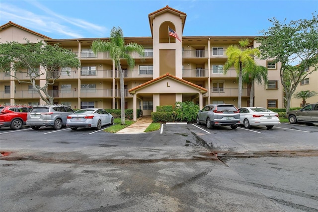 view of property with uncovered parking