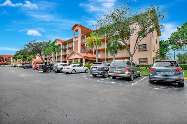 view of property featuring uncovered parking